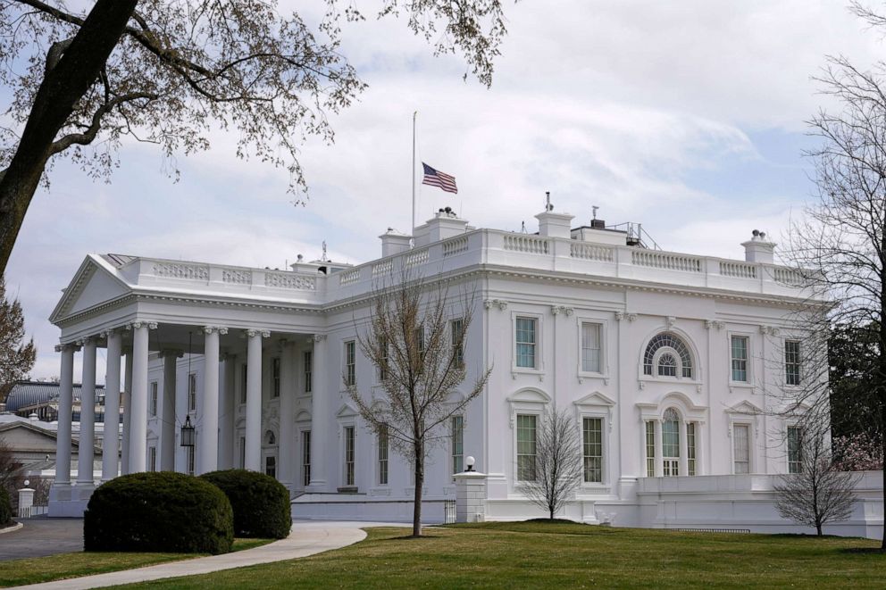PHOTO: The American flag flies at half-staff above the White House in Washington, March 23, 2021.