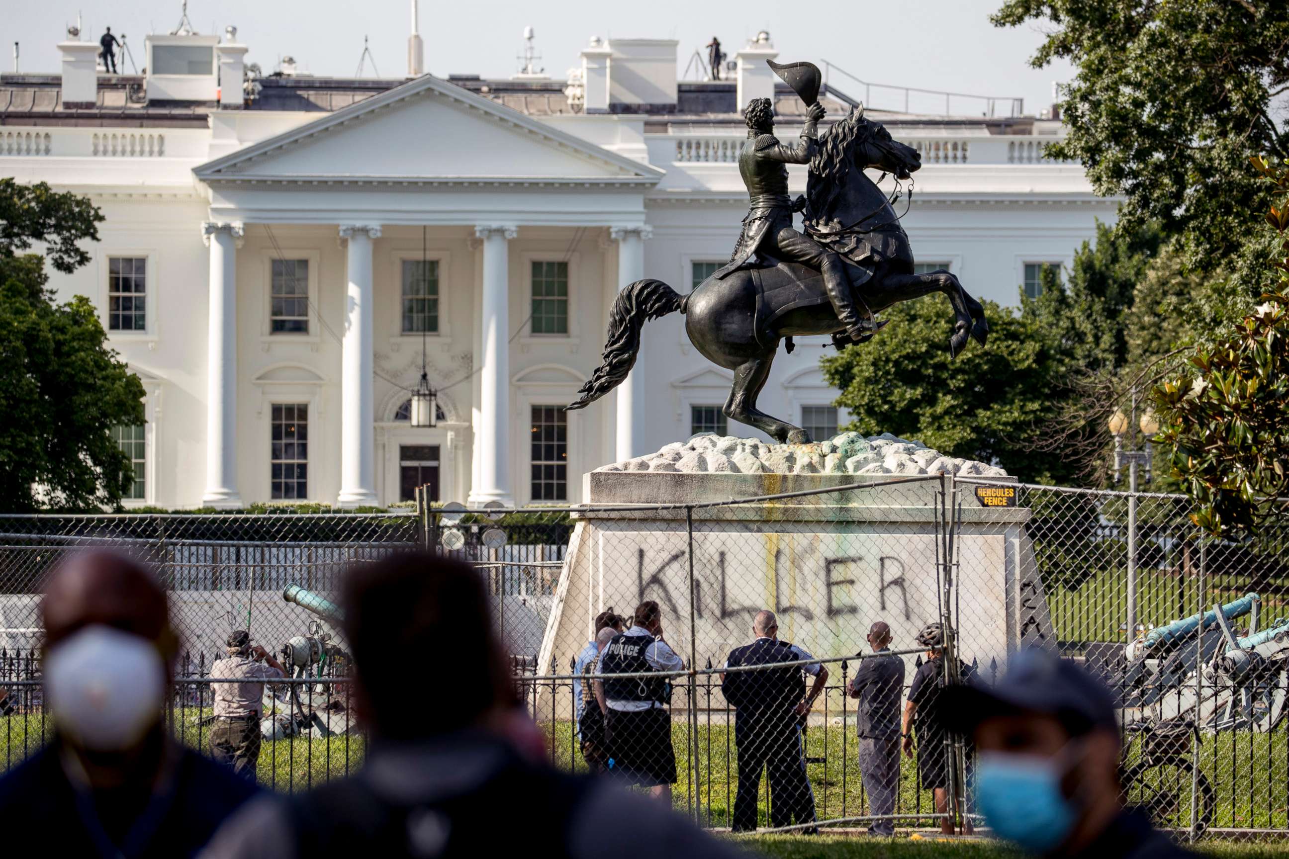 PHOTO: The White House is visible behind a statue of President Andrew Jackson in Lafayette Park, June 23, 2020, in Washington, with the word "Killer" spray painted on its base.