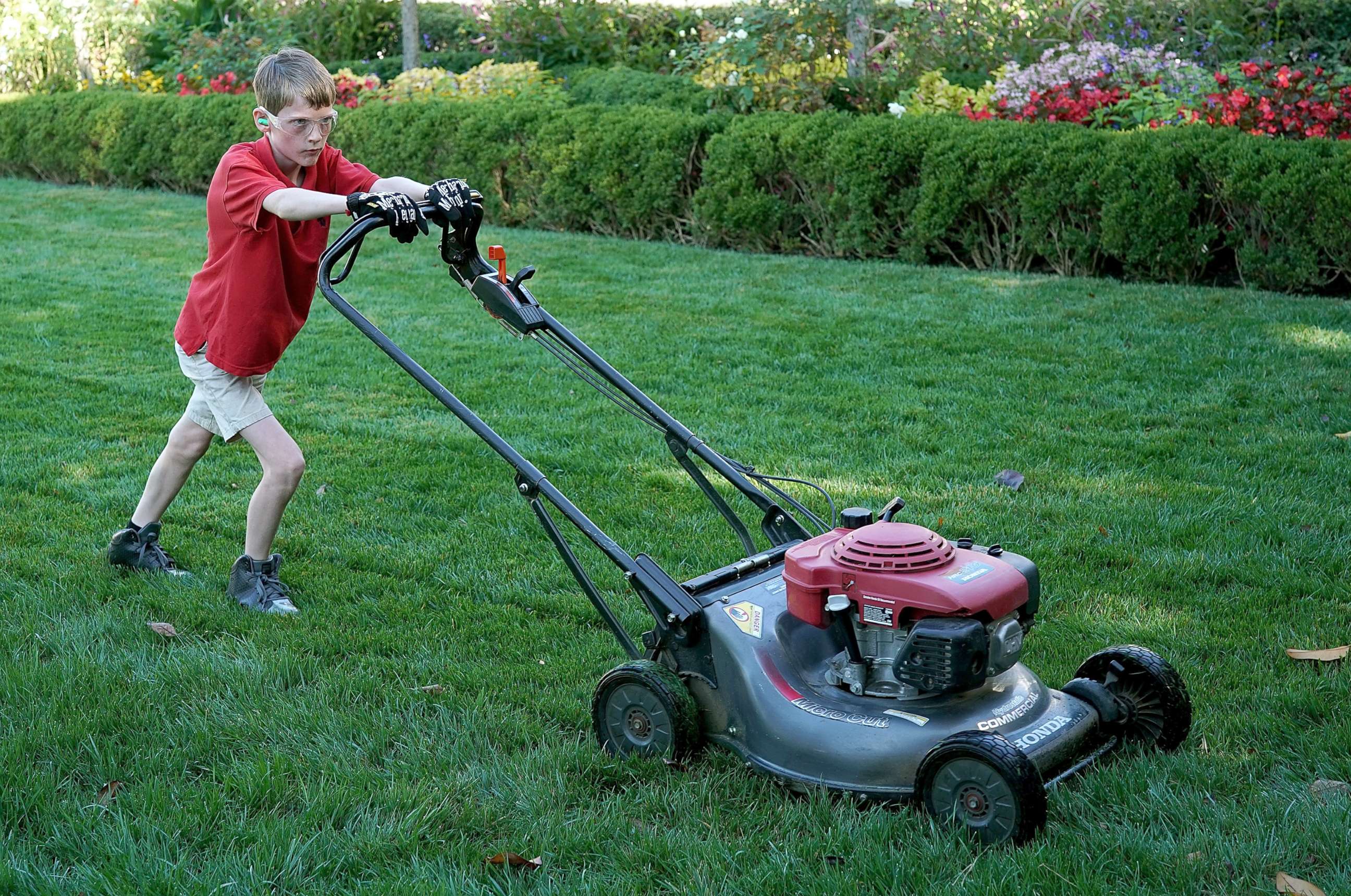 PHOTO: Frank "FX" Giaccio, 11, mows the grass in the Rose Garden of the White House, Sept. 15, 2017, in Washington.