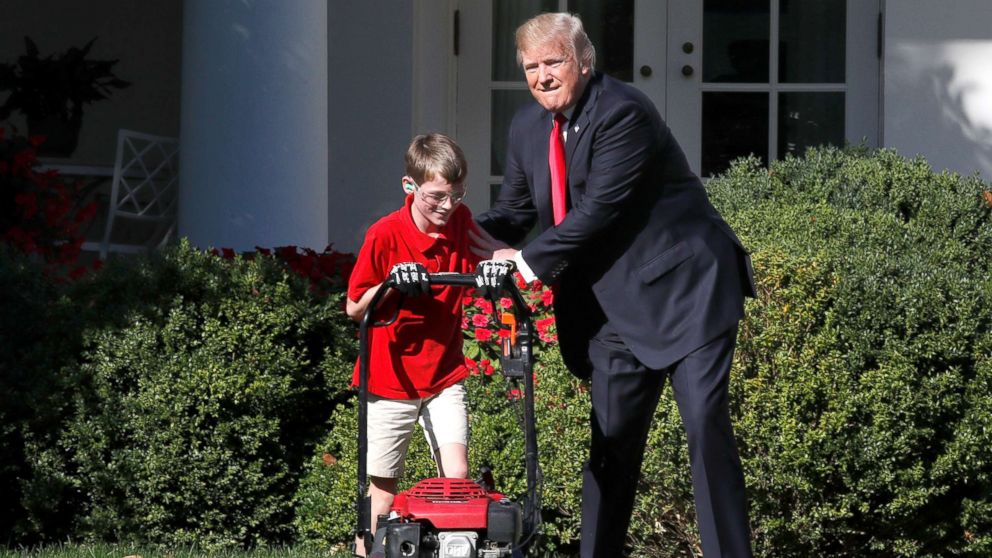 PHOTO: Frank Giaccio, 11, of Falls Church, Va., left, is encouraged by President Donald Trump, Sept. 15, 2017, while he mowed the lawn in the Rose Garden at the White House in Washington.