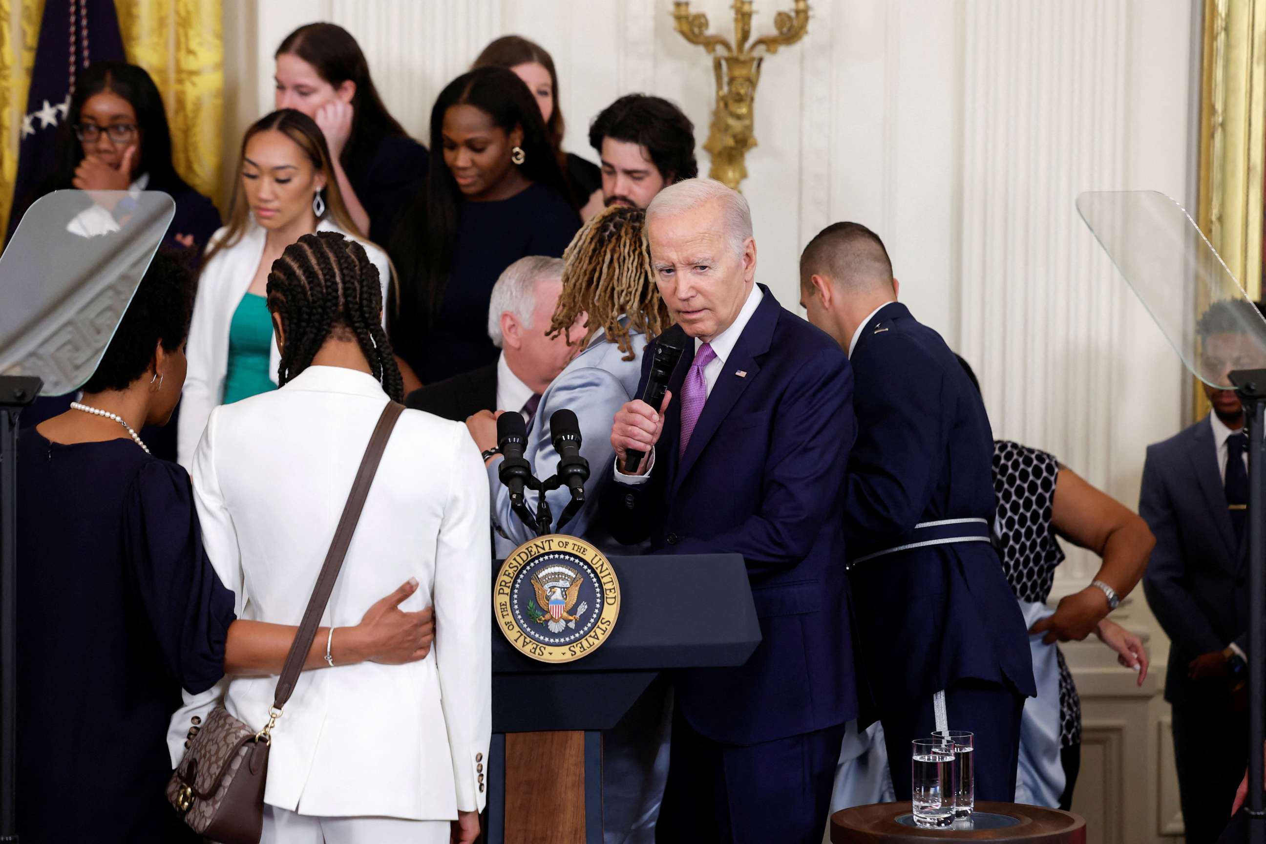 PHOTO: Player Sa'Myah Smith collapses during the event as President Joe Biden hosts a ceremony for the Louisiana State University Tigers women's basketball team to celebrate their 2022-2023 NCAA Championship season, at the White House, May 26, 2023.