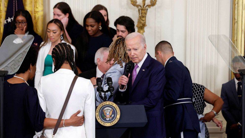 PHOTO: Player Sa'Myah Smith collapses during the event as President Joe Biden hosts a ceremony for the Louisiana State University Tigers women's basketball team to celebrate their 2022-2023 NCAA Championship season, at the White House, May 26, 2023.