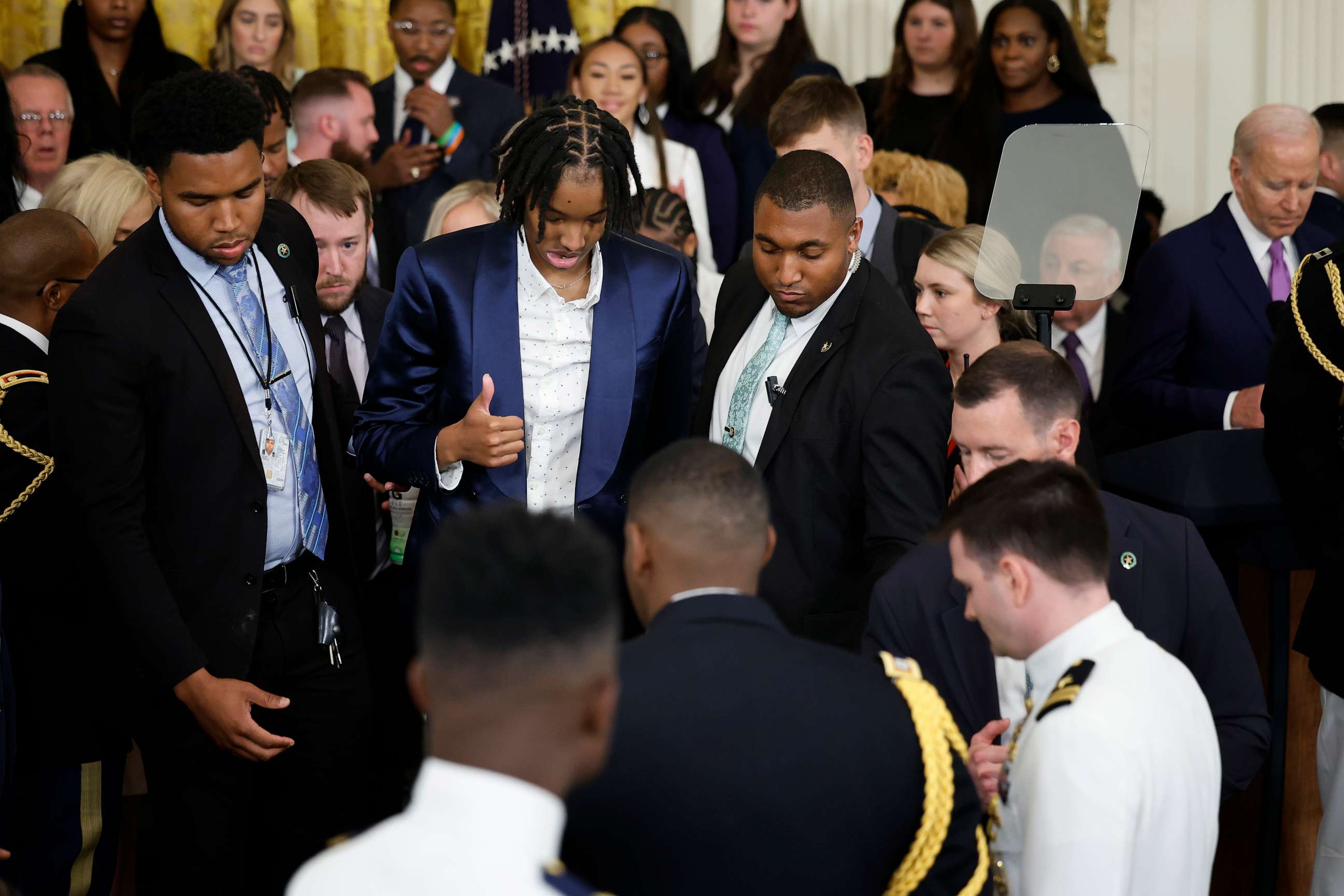 PHOTO: Louisiana State University team member Sa'Myah Smith flashes a thumbs-up after collapsing during a celebration of the team's NCAA Division I women's basketball national championship in the East Room of the White House on May 26, 2023.