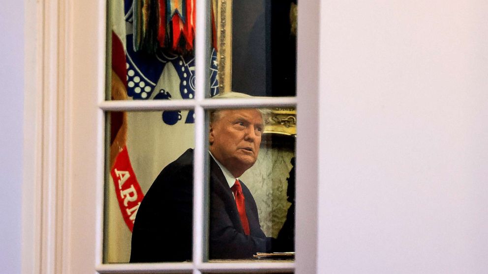 PHOTO: President Donald Trump sits in the Oval Office of the White House in Washington, Nov. 13, 2020.