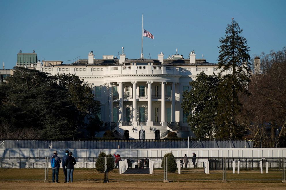The U.S. flag flies at half-staff above the White House in Washington, Sunday, Jan. 10, 2021. 