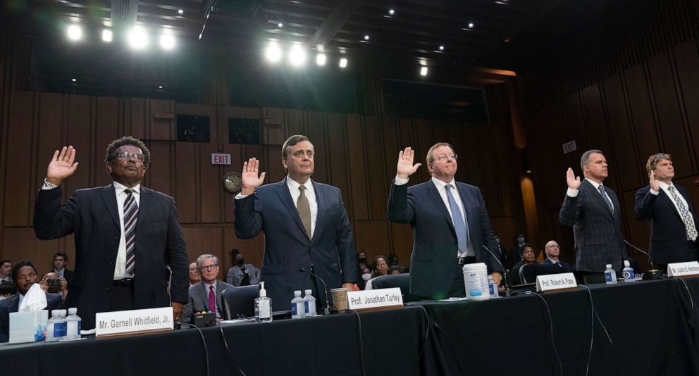 PHOTO: Garnell Whitfield, Jr., of Buffalo, N.Y., left, and other experts are sworn in to testify at a Senate Judiciary Committee hearing on domestic terrorism, June 7, 2022, in Washington. 