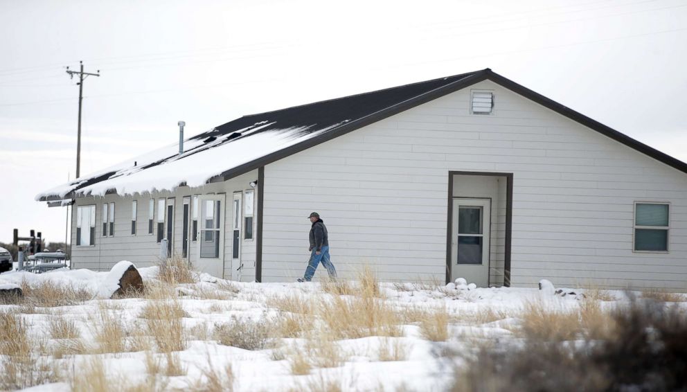 PHOTO: A member of the group occupying the Malheur National Wildlife Refuge headquarters walks to one of it's buildings, Jan. 4, 2016, near Burns, Oregon.