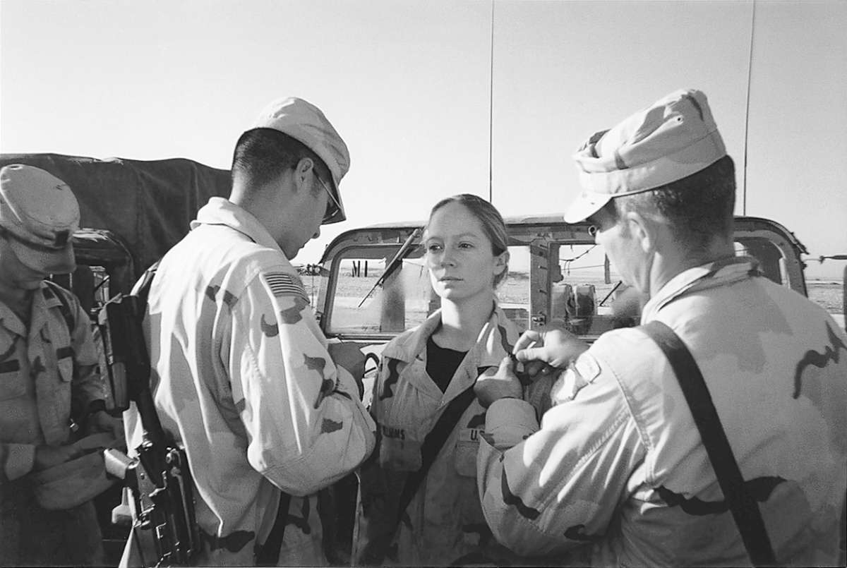 PHOTO: Kayla Williams participates in a pinning ceremony as part of being promoted to Sergeant in Tal Afar, Iraq in late 2003.