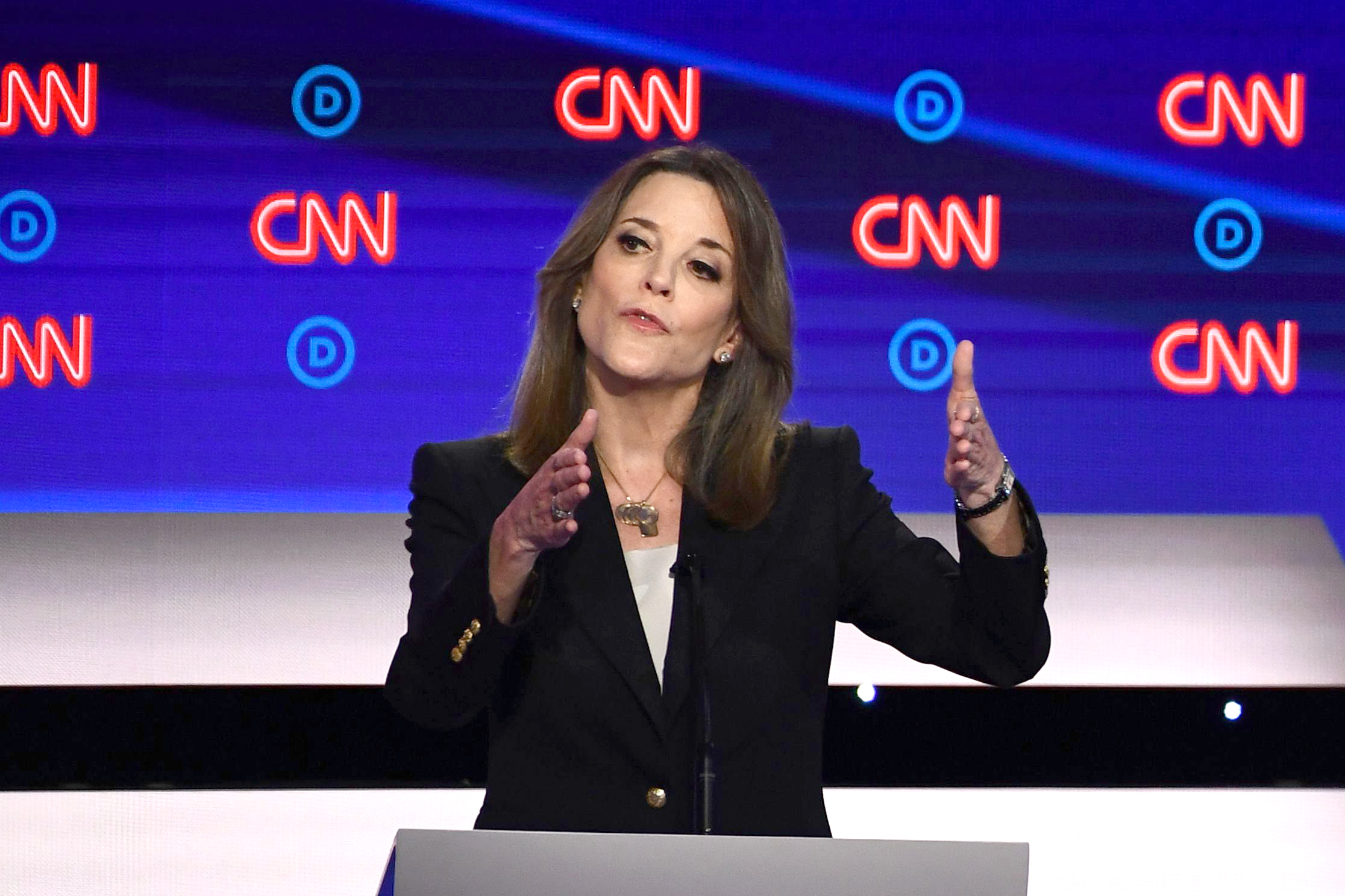PHOTO: Democratic presidential hopeful author and writer Marianne Williamson gestures as she speaks during the first round of the second Democratic primary debate in Detroit, July 30, 2019.