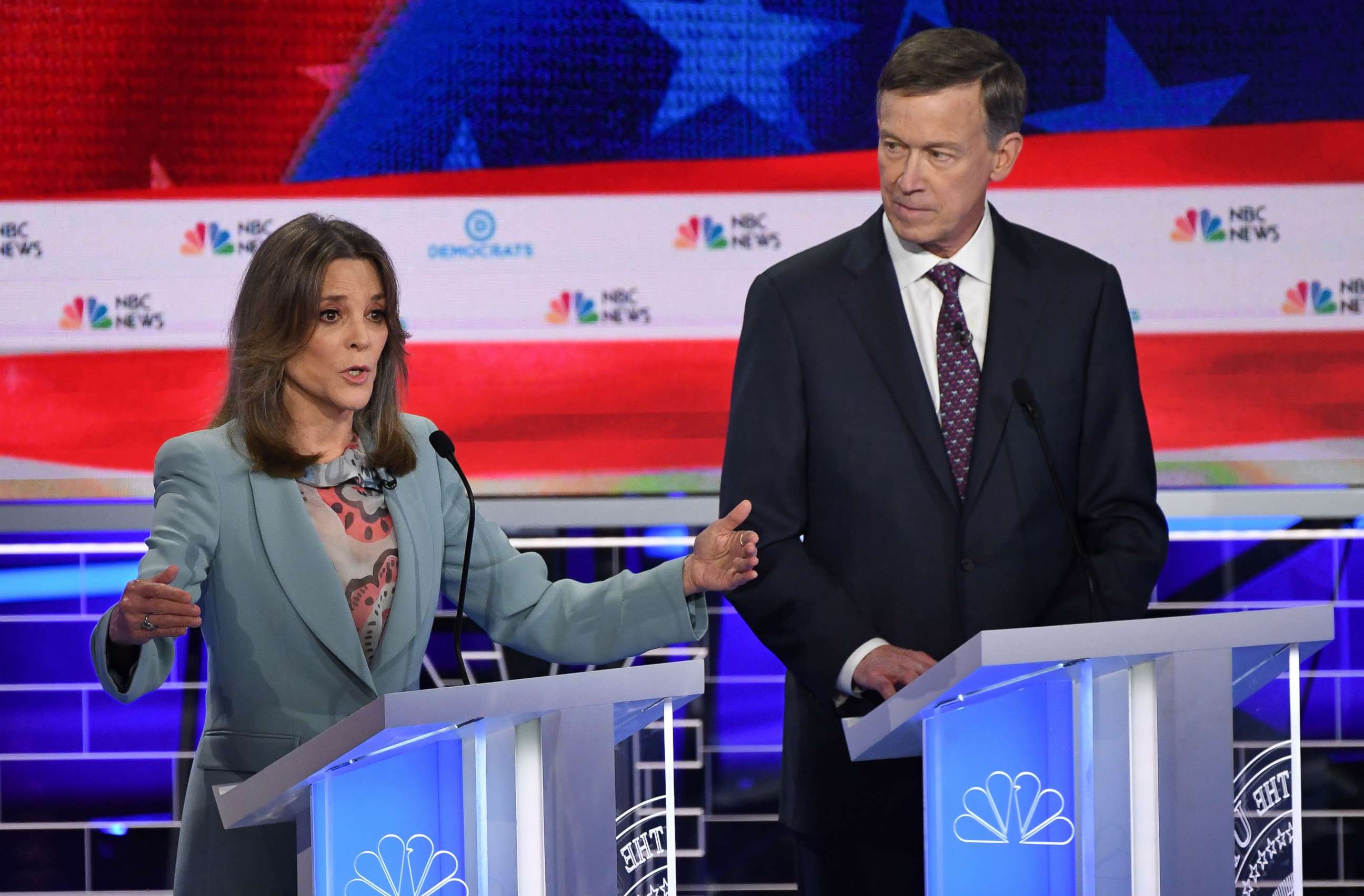 PHOTO: Marianne Williamson and John Hickenlooper participate in the second night of the first 2020 democratic presidential debate at the Adrienne Arsht Center for the Performing Arts in Miami, June 27, 2019.