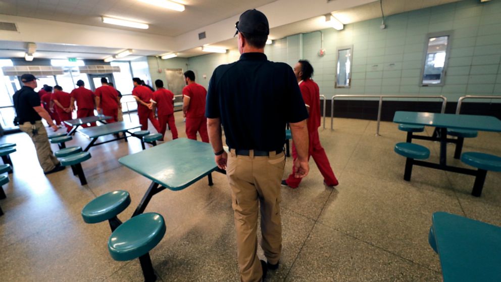 PHOTO: Detainees leave the cafeteria under the watch of guards during a media tour at the Winn Correctional Center in Winnfield, La., Sept. 26, 2019.