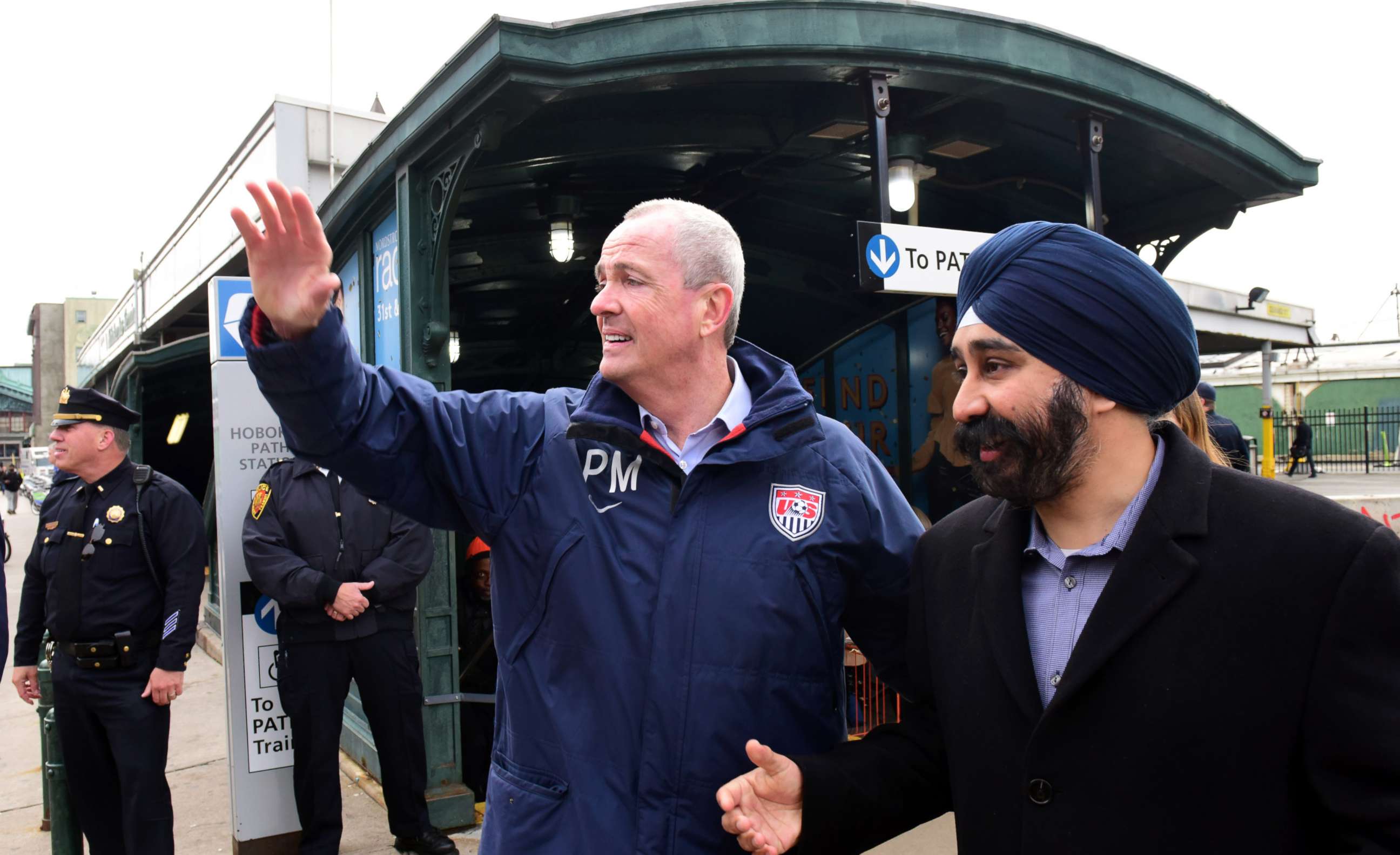 PHOTO: Phil Murphy, New Jersey Governor Elect, left, with Hoboken Mayor Elect Ravi Bhalla as they greet commuters at the Hoboken Path Station, Nov. 8, 2017.