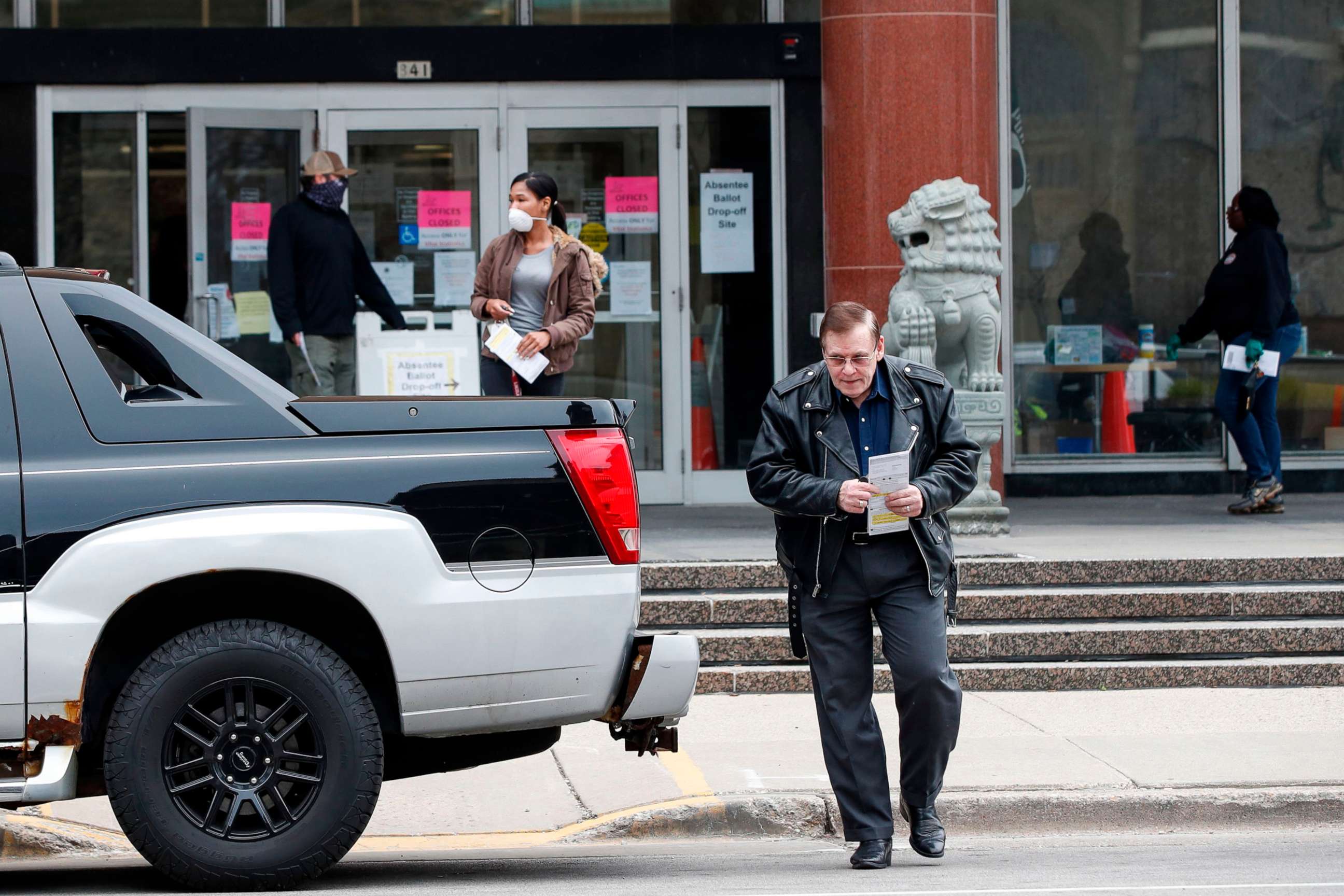 PHOTO: A man leaves the Frank P. Zeidler Municipal Building after not being able to cast his ballot at the already closed drop-off site in Milwaukee, Wisconsin, April 6, 2020.