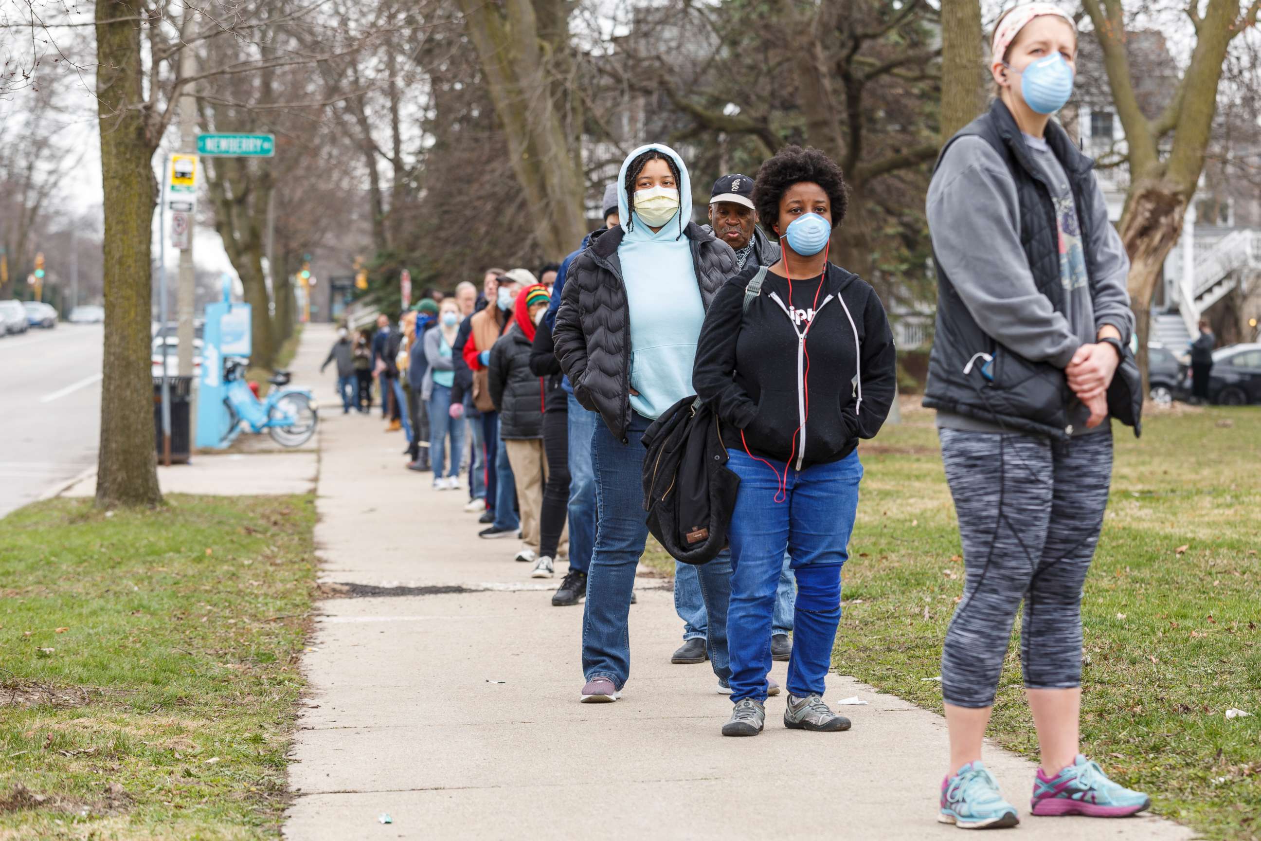 PHOTO: A line to vote in the Wisconsins spring primary election wraps around for blocks and blocks at Riverdale High School on April 7, 2020, in Milwaukee.