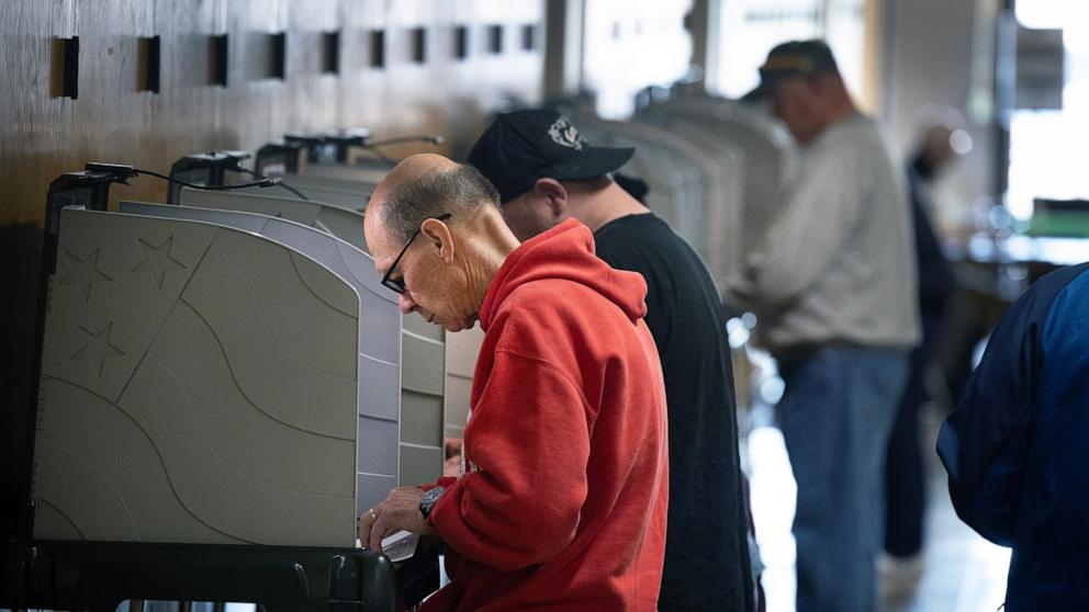 PHOTO:  Residents vote at an in-person early voting location in the Kenosha Municipal Building on Oct. 24, 2024, in Kenosha, Wisconsin.