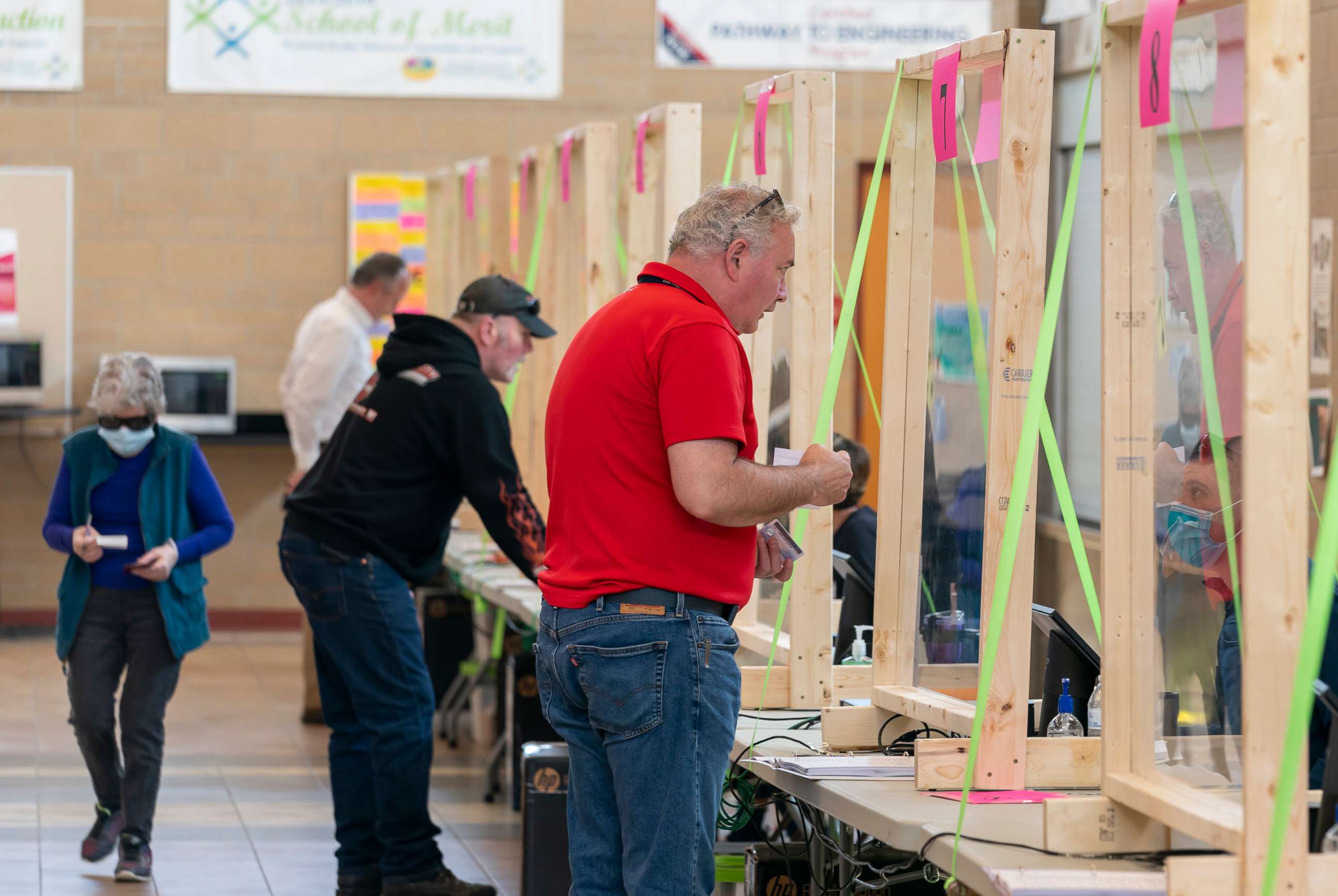 PHOTO: People check in to vote at a polling place on April 7, 2020, in Sun Prairie, Wisconsin.