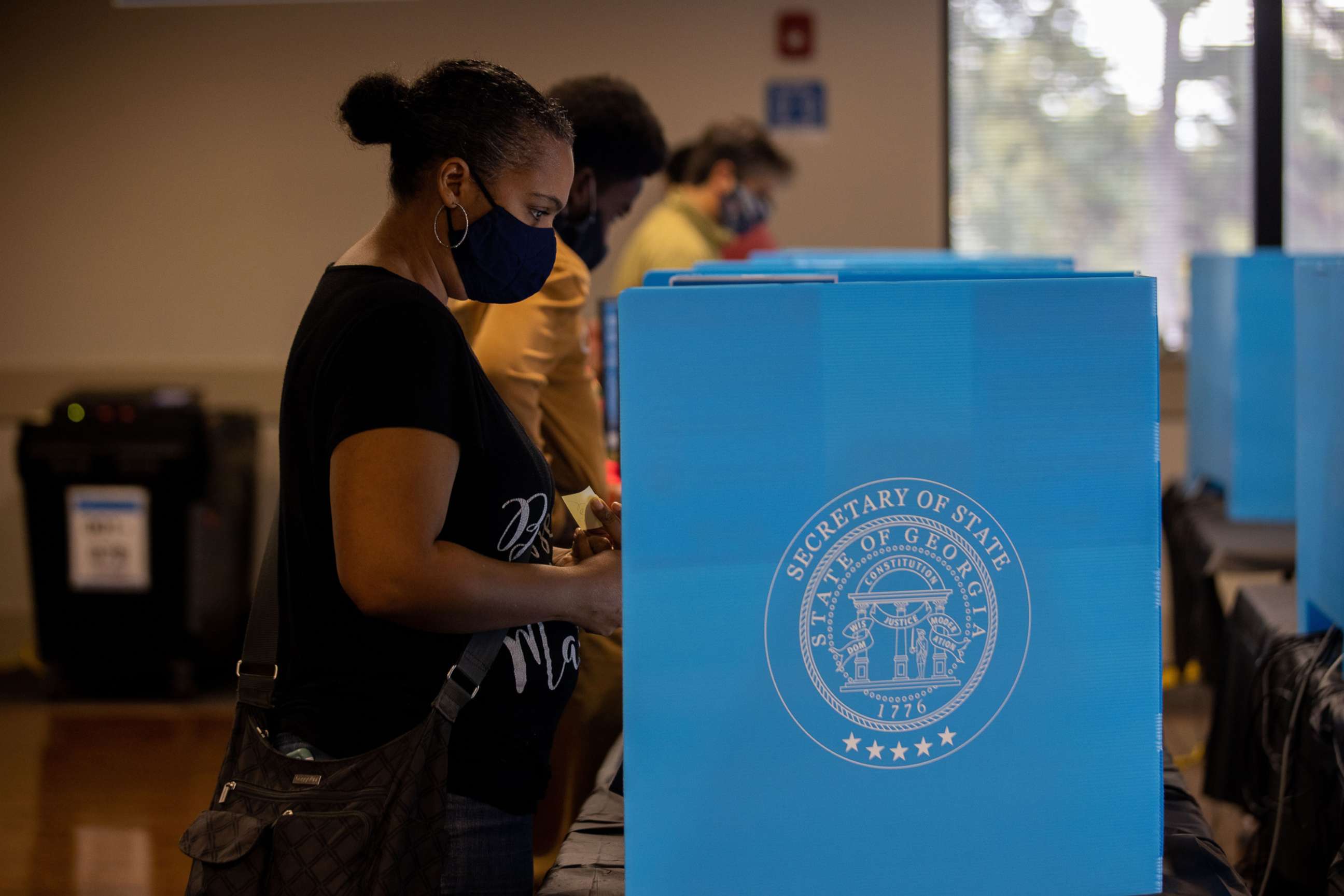 PHOTO: People vote early at the Shorty Howell Park early voting location on Oct. 24, 2020, in Duluth, Ga.