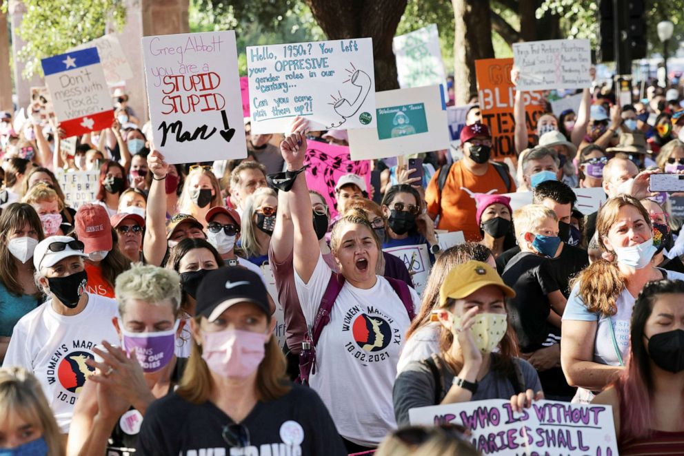 PHOTO: Women's rights advocates hold signs during the nationwide Women's March in Austin, Texas, Oct. 2, 2021. 
