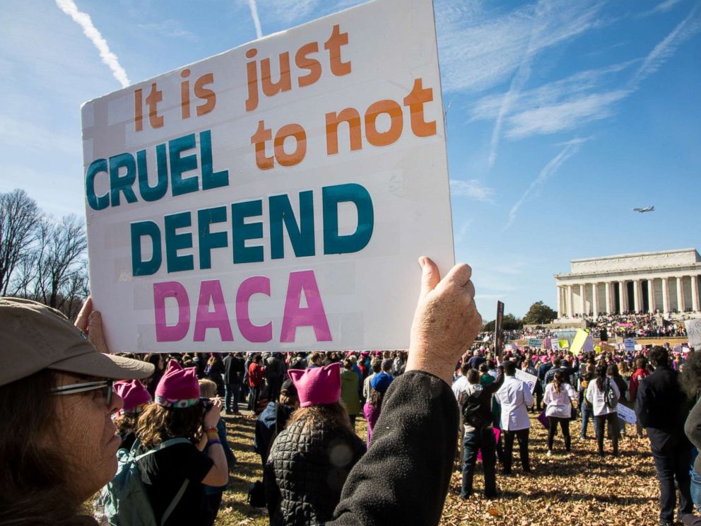 PHOTO: A demonstrator holds a sign saying It is just cruel to not defend DACA as thousands of activists gathered on the National Mall and marched to the White House for the 2018 Womens March on Washington D.C., Jan. 20, 2018.