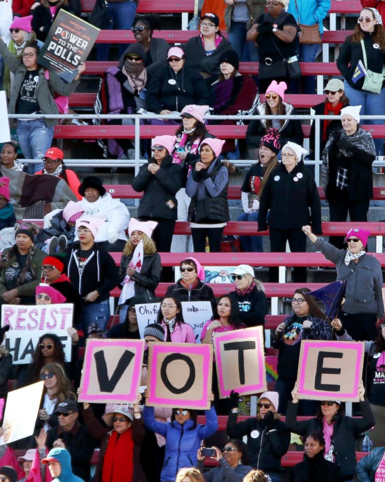 PHOTO: Attendees stand during the Women's March Anniversary "Power To The Polls" event, Jan. 21, 2018, at Sam Boyd Stadium in Las Vegas.