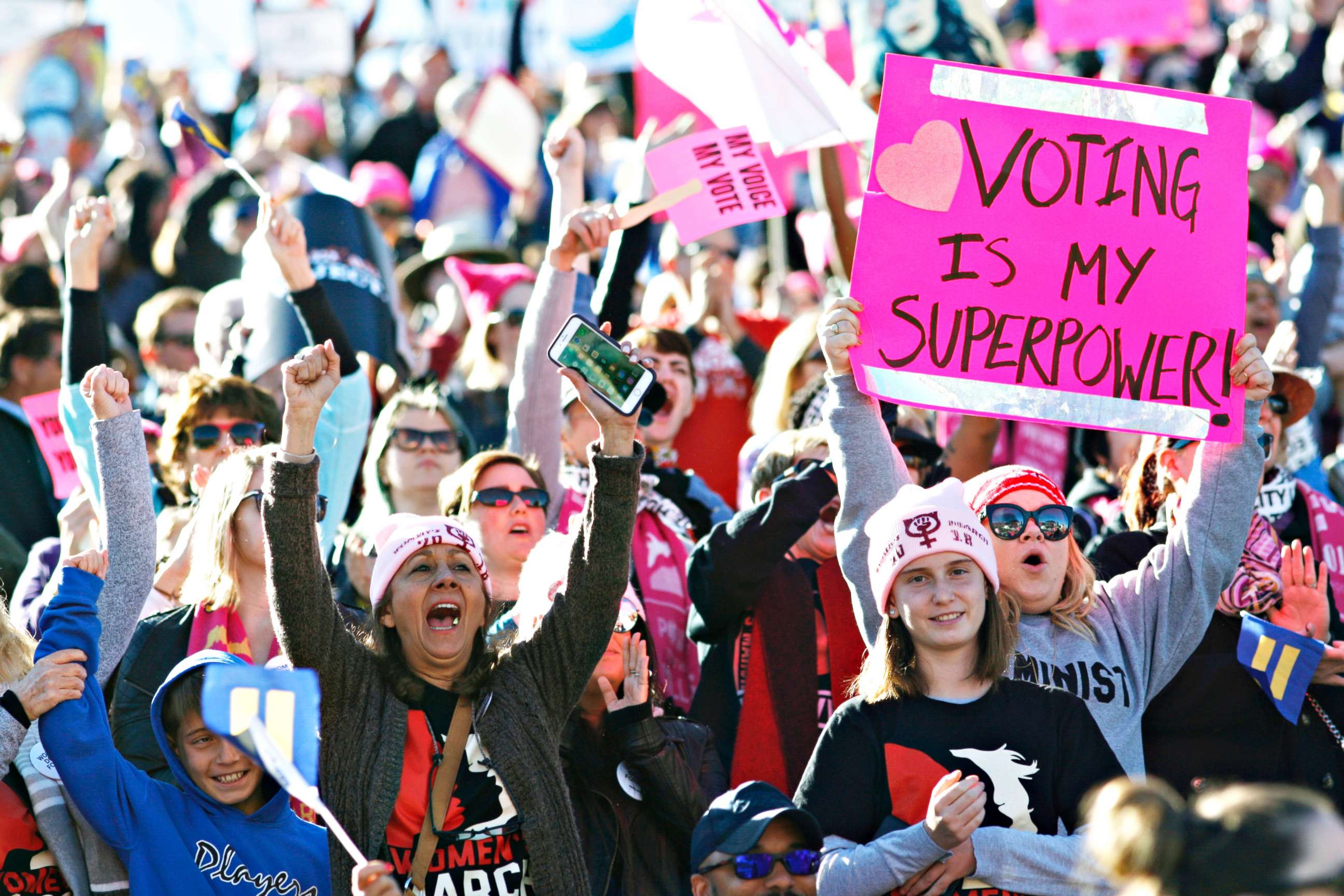 PHOTO: People cheer a speaker during the Women's March "Power to the Polls" voter registration tour launch at Sam Boyd Stadium on Jan. 21, 2018, in Las Vegas.