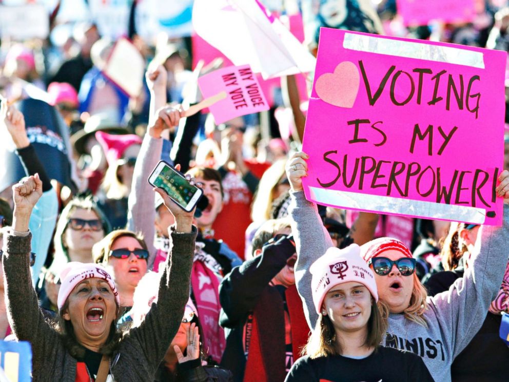 PHOTO: People cheer a speaker during the Womens March Power to the Polls voter registration tour launch at Sam Boyd Stadium on Jan. 21, 2018, in Las Vegas.