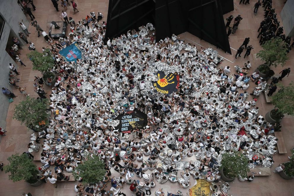 PHOTO: Protesters that marched from Freedom Plaza to the U.S. Capitol demonstrate inside the Hart Senate Office Building against family detentions, June 28, 2018 in Washington, D.C.