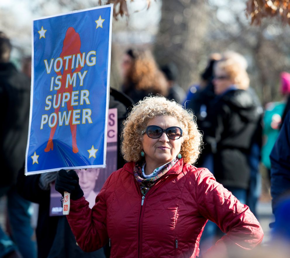 PHOTO: Cathryn Harjung of Elkton, Md. holds her sign before the start of the Women's March in Newark, N.J.