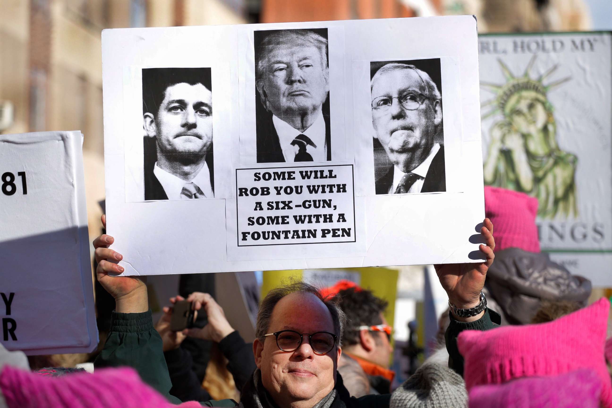 PHOTO: A man holds a sign as he attends the Womens March, Jan. 20, 2018 in New York City.