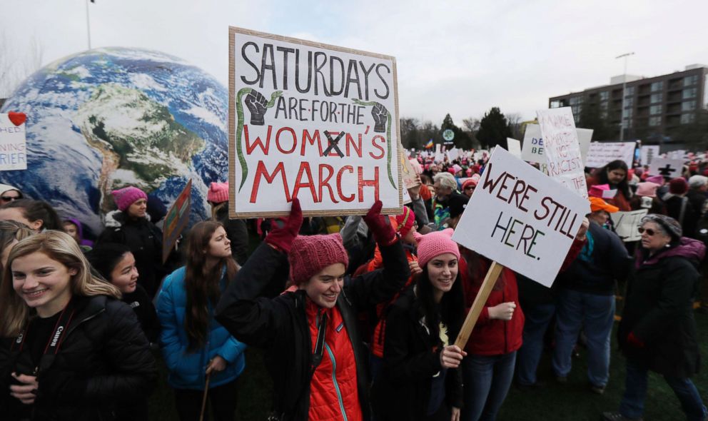 PHOTO: A woman holds as sign as she takes part in a Women's March in Seattle, Jan. 20, 2018.