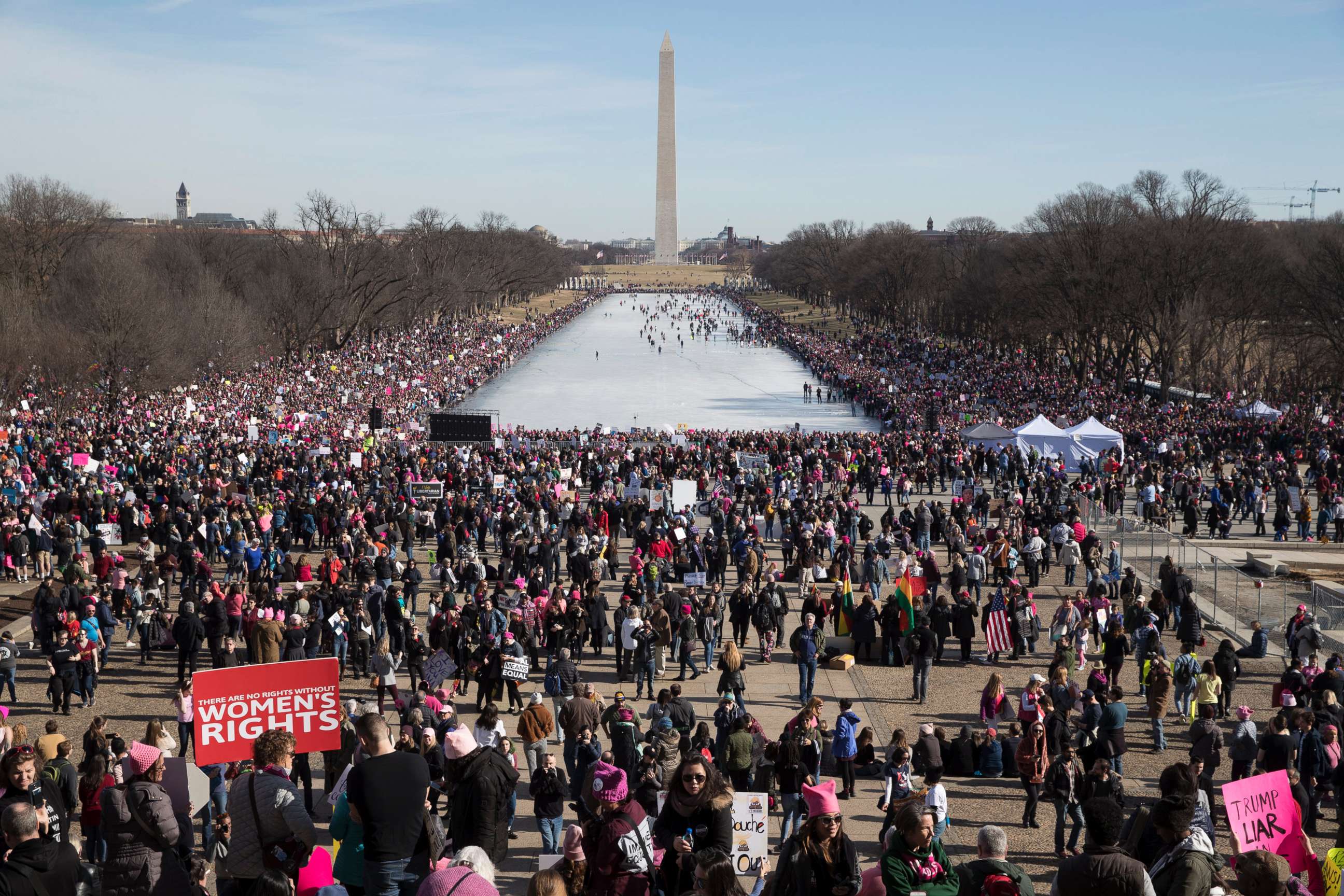 PHOTO: Thousands of people participate in the Women's March, beside the Lincoln Memorial Reflecting Pool in Washington, D.C., Jan. 20, 2018.