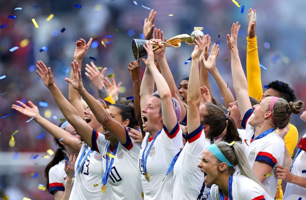 PHOTO: Megan Rapinoe lifts the FIFA Women's World Cup Trophy following her team's victory in the 2019 FIFA Women's World Cup France Final match between USA and The Netherlands at Stade de Lyon on July 7, 2019 in Lyon, France.