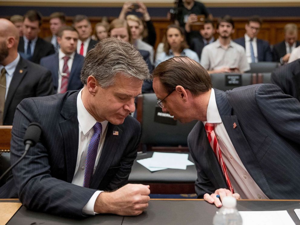 PHOTO: FBI Director Christopher Wray, left, speaks with Deputy Attorney General Rod Rosenstein during the start of the hearing on the Justice Department and FBI actions around the 2016 presidential election, June 28, 2018, in Washington, D.C.