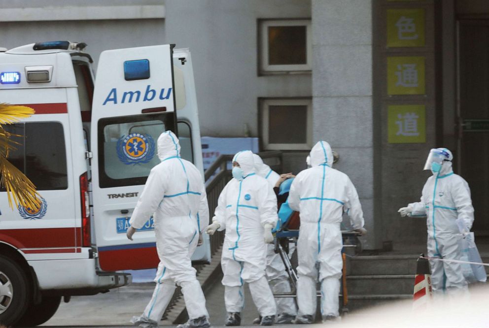 PHOTO: In this Jan. 20, 2020, file photo, medical staff transfer patients to Jinyintan hospital where patients infected with a new strain of Coronavirus identified as the cause of the Wuhan pneumonia outbreak are treated in Wuhan, Hubei province, China.