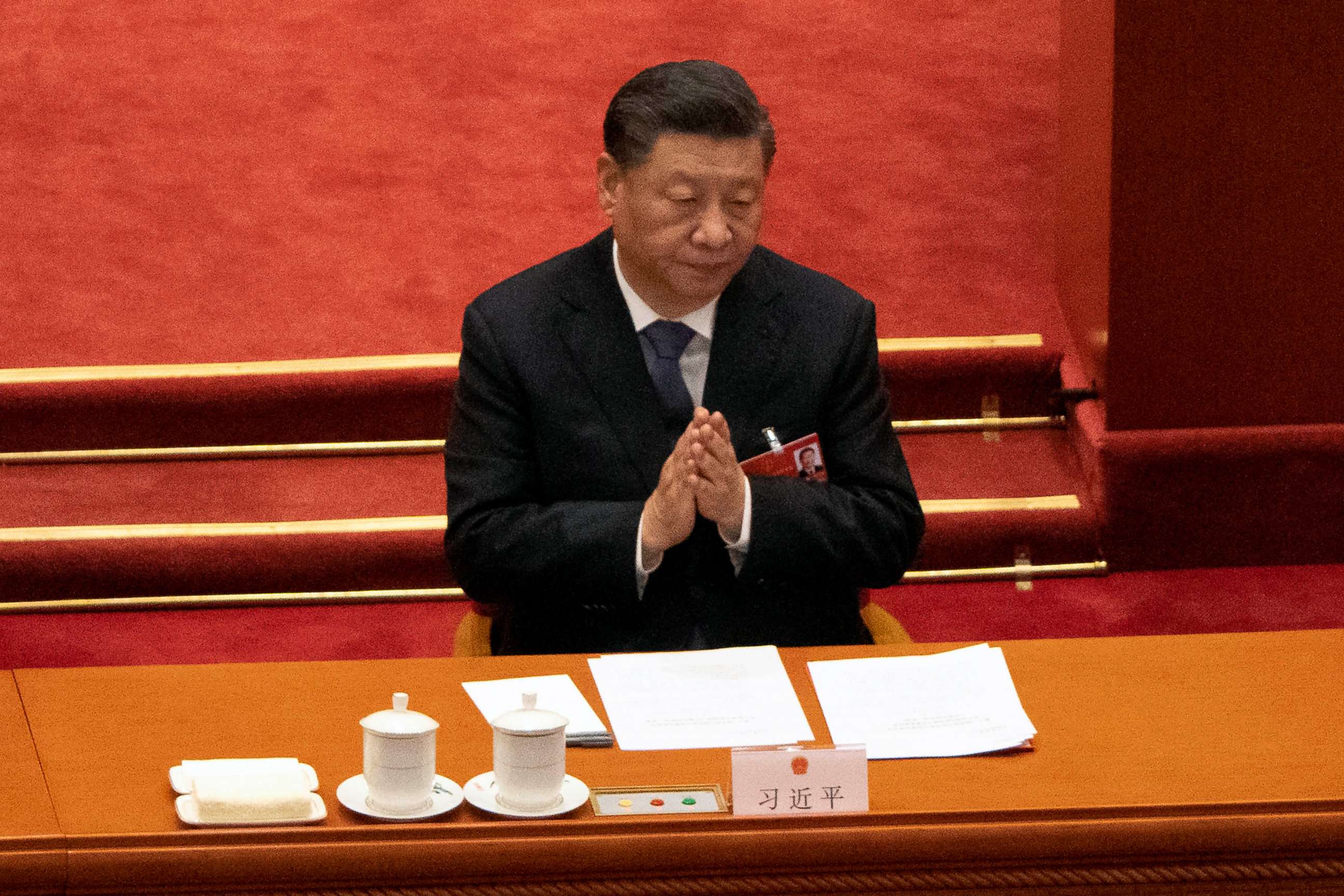 PHOTO: In this March 11, 2022 file photo Chinese President Xi Jinping applauds during the closing session of China's National People's Congress at the Great Hall of the People in Beijing.