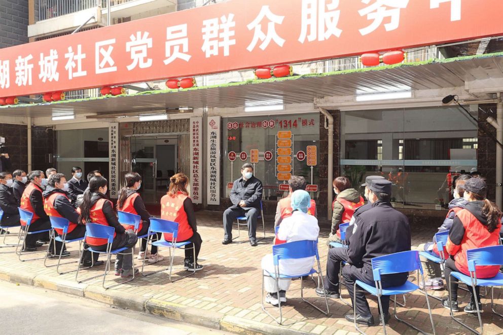 PHOTO: Chinese President Xi Jinping talks with community workers, police officers, medical workers, officials and volunteers at a community in Wuhan, central China's Hubei Province, March 10, 2020.