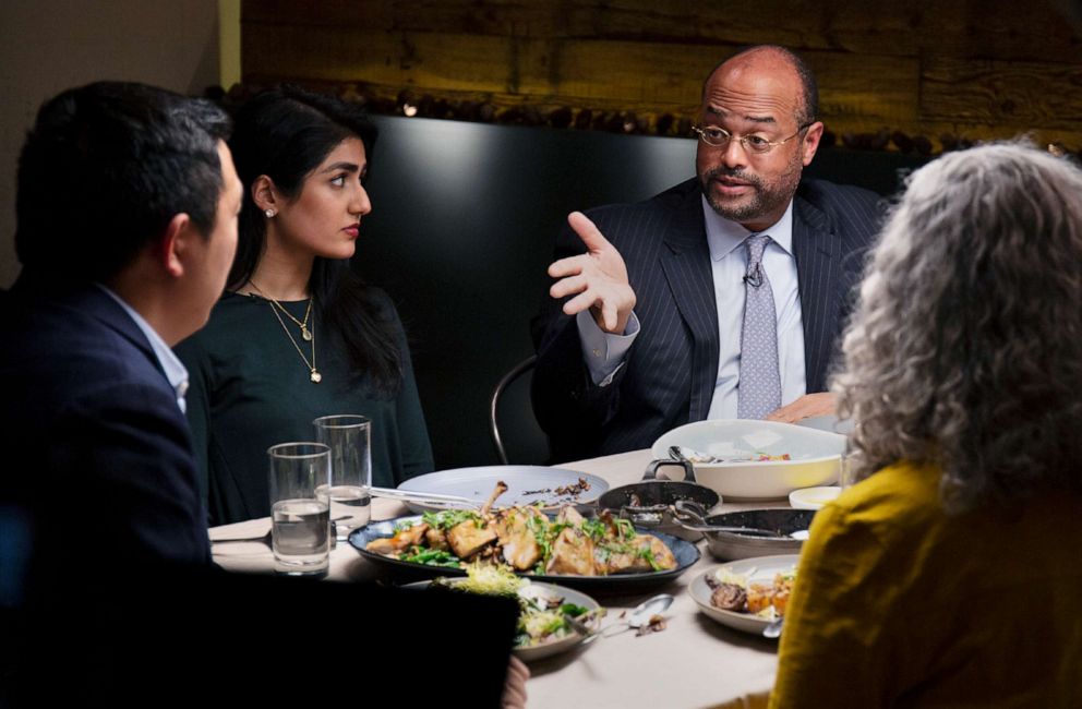 PHOTO: Democratic presidential candidate Andrew Yang, left, listens to Ramsey Smith, right, during a dinner with Jaslin Kaur and Mara Novak, in New York, Dec. 4, 2019.