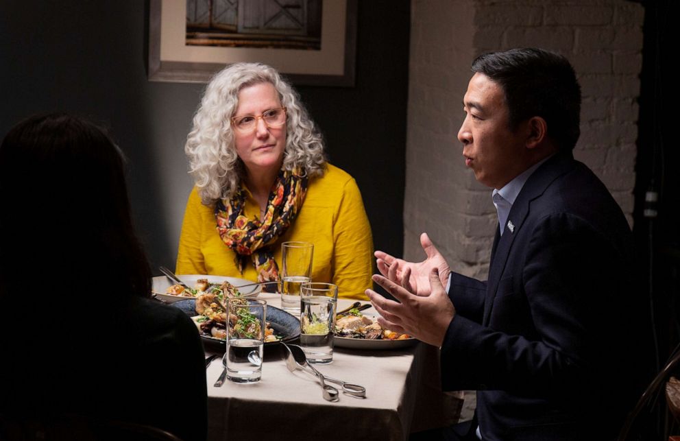 PHOTO: Democratic presidential candidate Andrew Yang, right, talks during a dinner with Mara Novak and other voters, in New York, Dec. 4, 2019.