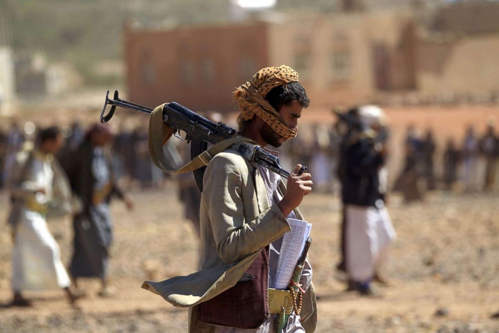 PHOTO: A Yemeni man carries a Kalashnikov rifle as he takes part in a gathering near Sanaa, to show support to the Shiite Huthi movement against the Saudi-led intervention, Feb. 21, 2019.