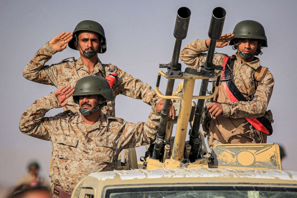 PHOTO: Soldiers salute during a military parade in a graduation ceremony for new cadets of the armed forces of the Saudi-backed and internationally-recognised Yemeni government in Marib, Yemen, June 16, 2022.