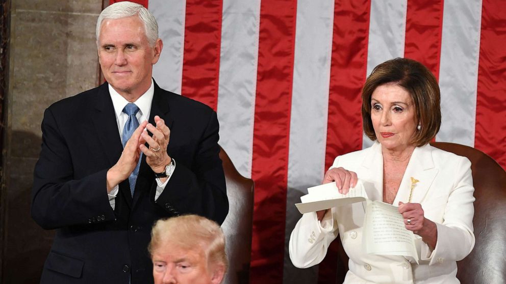 PHOTO: Vice President Mike Pence claps as Speaker of the House of Representatives Nancy Pelosi rips a copy of President Donald Trump's speech after he delivered the State of the Union address at the U.S. Capitol in Washington, D.C., Feb. 4.