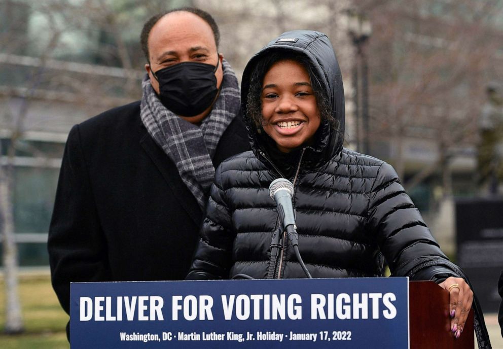PHOTO: Yolanda Renee King, granddaughter of Martin Luther King, Jr. speaks as her father Martin Luther King III listens during a rally ahead of the Peace Walk in celebration of Martin Luther King Jr. Day in Washington, D.C., Jan. 17, 2022.