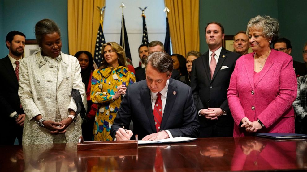 PHOTO: Virginia Gov. Glenn Youngkin signs executive orders in the Governors conference room at the Capitol on Jan. 15, 2022, in Richmond, Va.