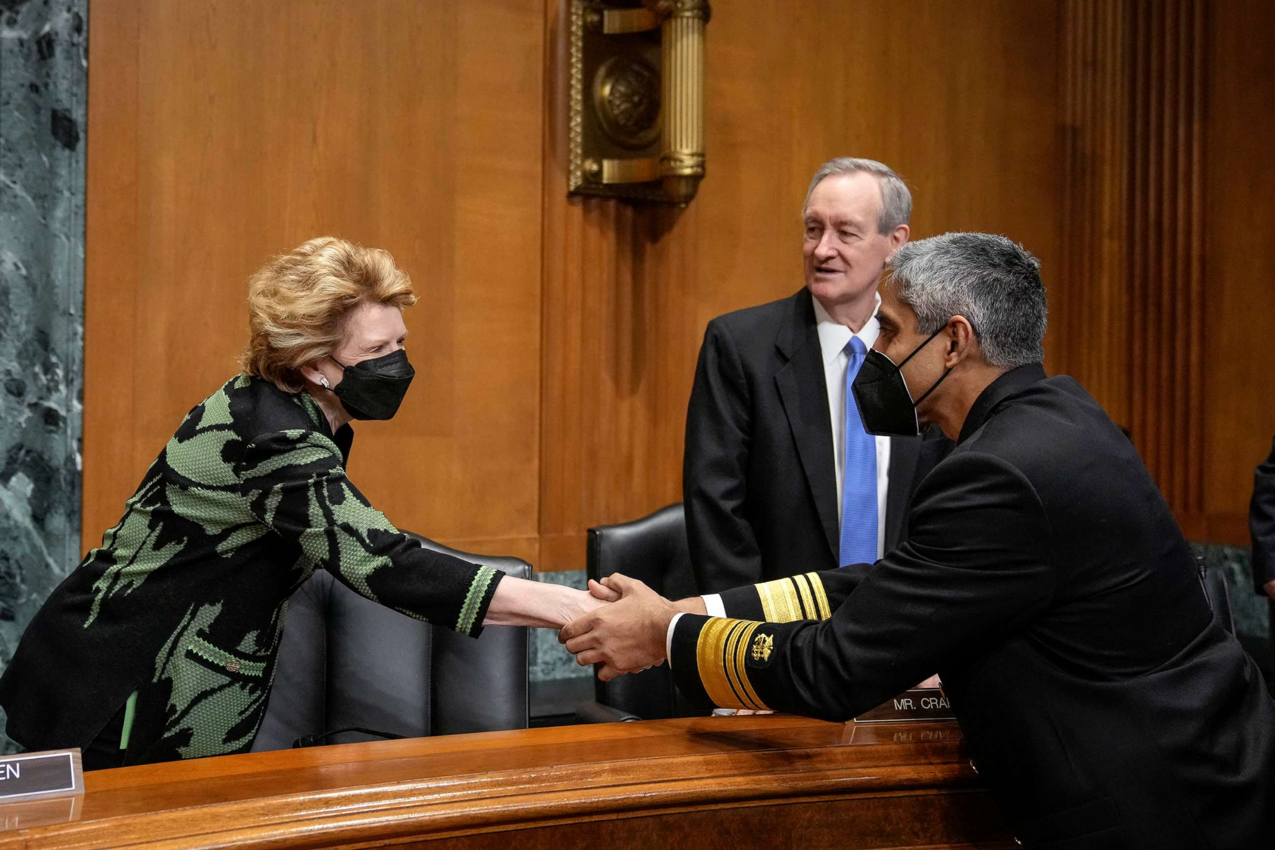 PHOTO: Sen. Debbie Stabenow greets Surgeon General Dr. Vivek Murthy as he arrives for a Senate Finance Committee hearing about youth mental health on Capitol Hill, Feb. 8, 2022.