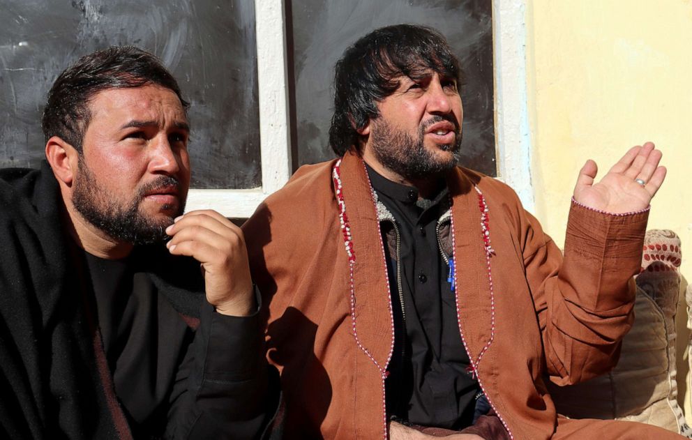 PHOTO: In this Dec. 14, 2021, file photo, Ajmal Ahmadi, right, a brother of Zemerai Ahmadi, speaks during an interview with The Associated Press at the Ahmadi family home, in Kabul, Afghanistan.