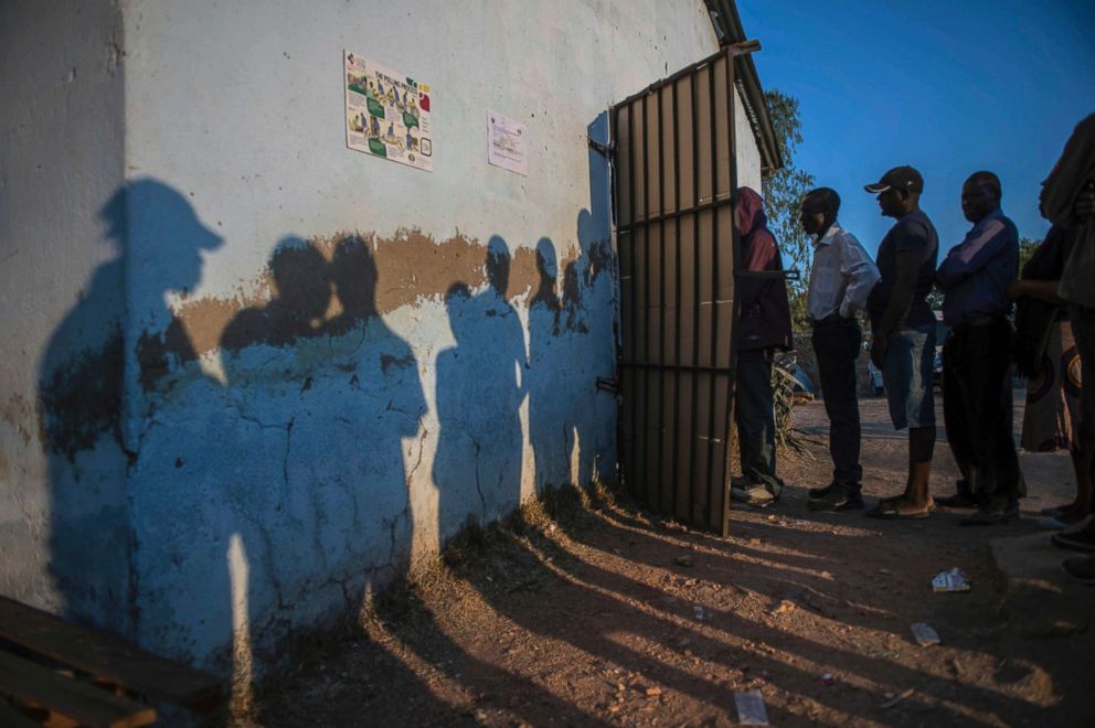 PHOTO: Voters queue to cast their votes at a polling station in Harare, Zimbabwe, Monday July 30, 2018.