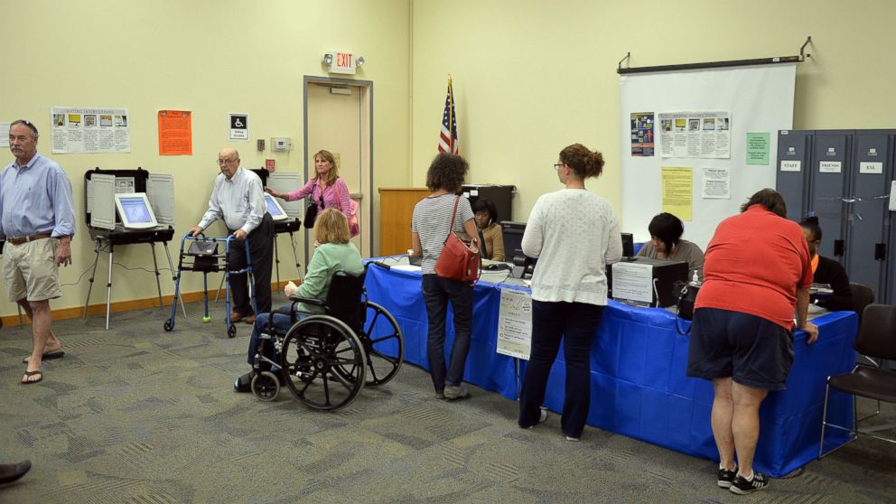A steady stream of voters head to the polls at the Roswell, Ga.,  Public Library in Fulton County, Oct. 26, 2014.