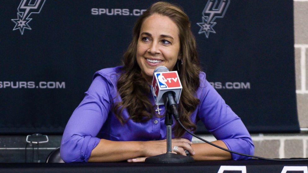 WNBA star Becky Hammon takes questions from the media at the San Antonio Spurs practice facility after being introduced as an assistant coach with the team, Aug. 5, 2014 in San Antonio.