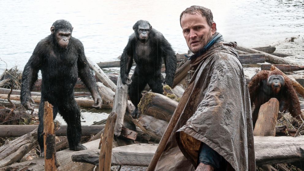 Jason Clarke, as Malcolm, foreground, and, Andy Serkis, as Caesar; Toby Kebbell, as Koba; and Karin Konoval, as Maurice; in a scene from the film, "Dawn of the Planet of the Apes."