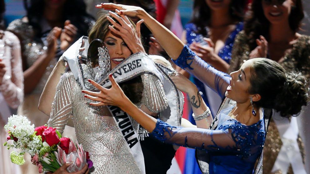 Miss Universe 2012 Olivia Culpo, from the United States, right, places the crown on Miss Venezuela Gabriela Isler during the 2013 Miss Universe pageant in Moscow, Russia, on Saturday, Nov. 9, 2013. 